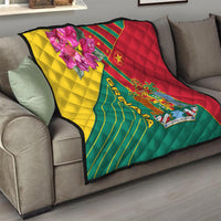 Grenada flag quilt blanket draped on sofa, quilted pattern with crest emblem and orchid detail