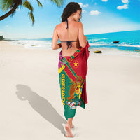 Grenada sarong wrap tied at waist, red and green with yellow stripes and Grenada text