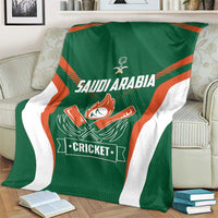Green cricket team blanket on sofa, featuring Saudi Arabia lettering and Cricket logo