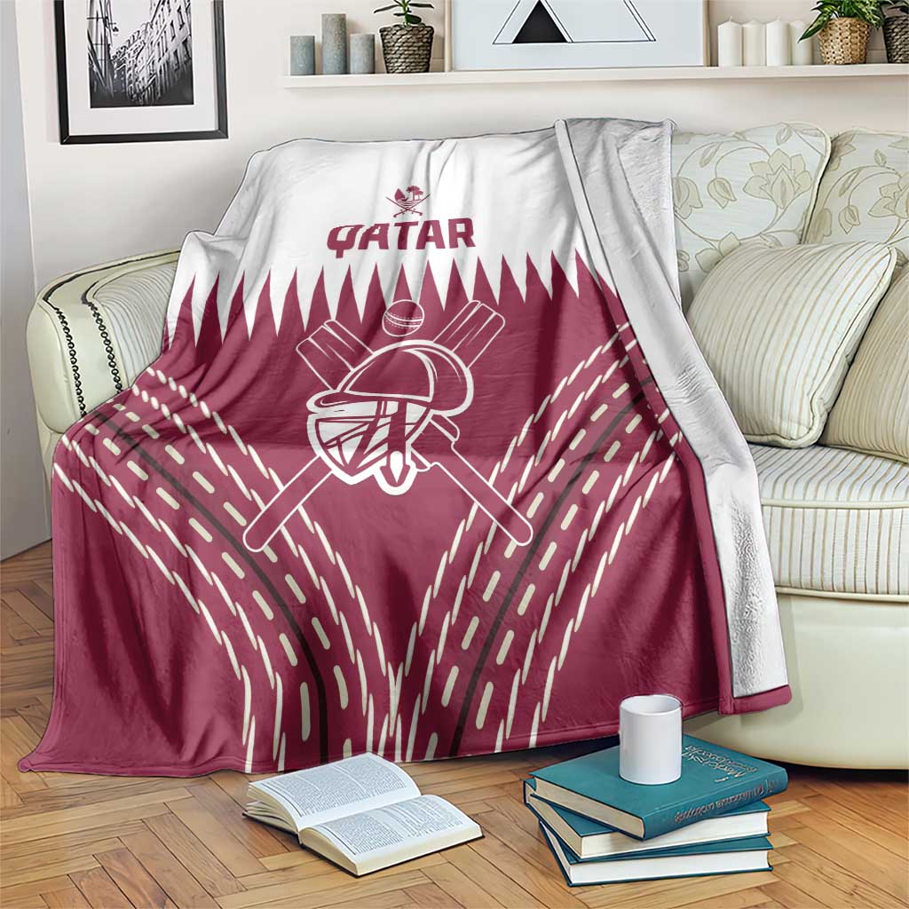 Qatar cricket blanket over sofa, maroon shield and batting figure print
