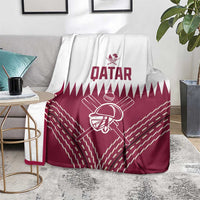 Qatar cricket blanket draped on chair, Qatar text and cricket player graphic