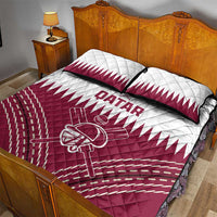 Red and white Qatar cricket quilt bed set with two pillows on a wooden bed