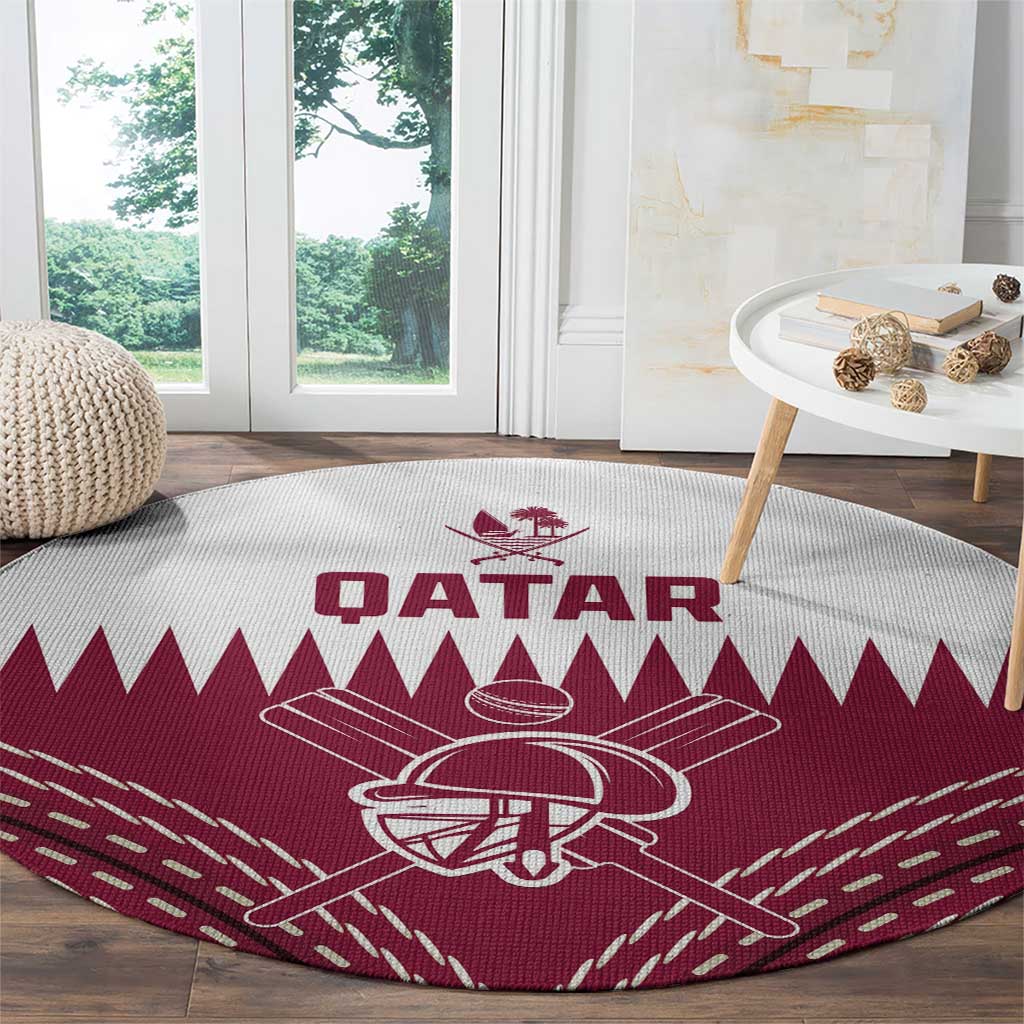 Red round cricket carpet featuring white Qatar text and bat-and-ball outline