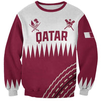 Boys crewneck sweatshirt with maroon and light gray paneling and Qatar graphic on front