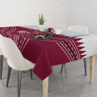 Red tablecloth with white Qatar cricket graphic and starburst stripe pattern