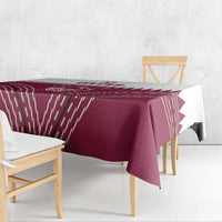 Maroon red tablecloth with white Qatar cricket emblem and geometric streaks