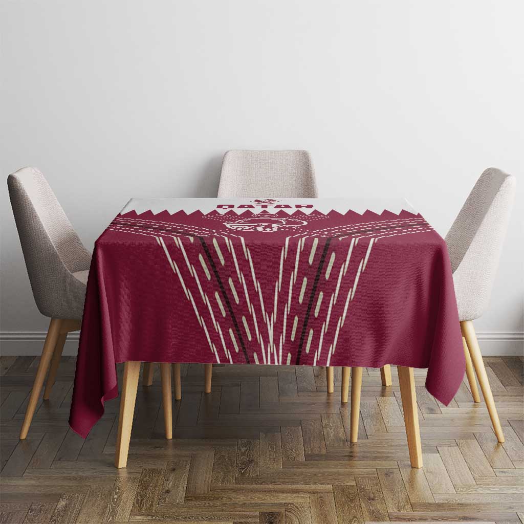 Red tablecloth with white Qatar cricket graphic and geometric streak pattern