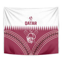 Close view of red and white Qatar cricket tapestry with “QATAR” and helmet emblem at center