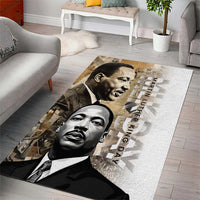 White rectangular area rug with two black-and-white MLK faces and day text