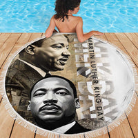 Fringed round beach blanket with MLK portraits and “Martin Luther King Day” lettering
