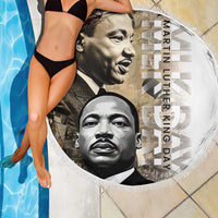 Fringed round beach blanket showing MLK portraits with “Martin Luther King Day” lettering
