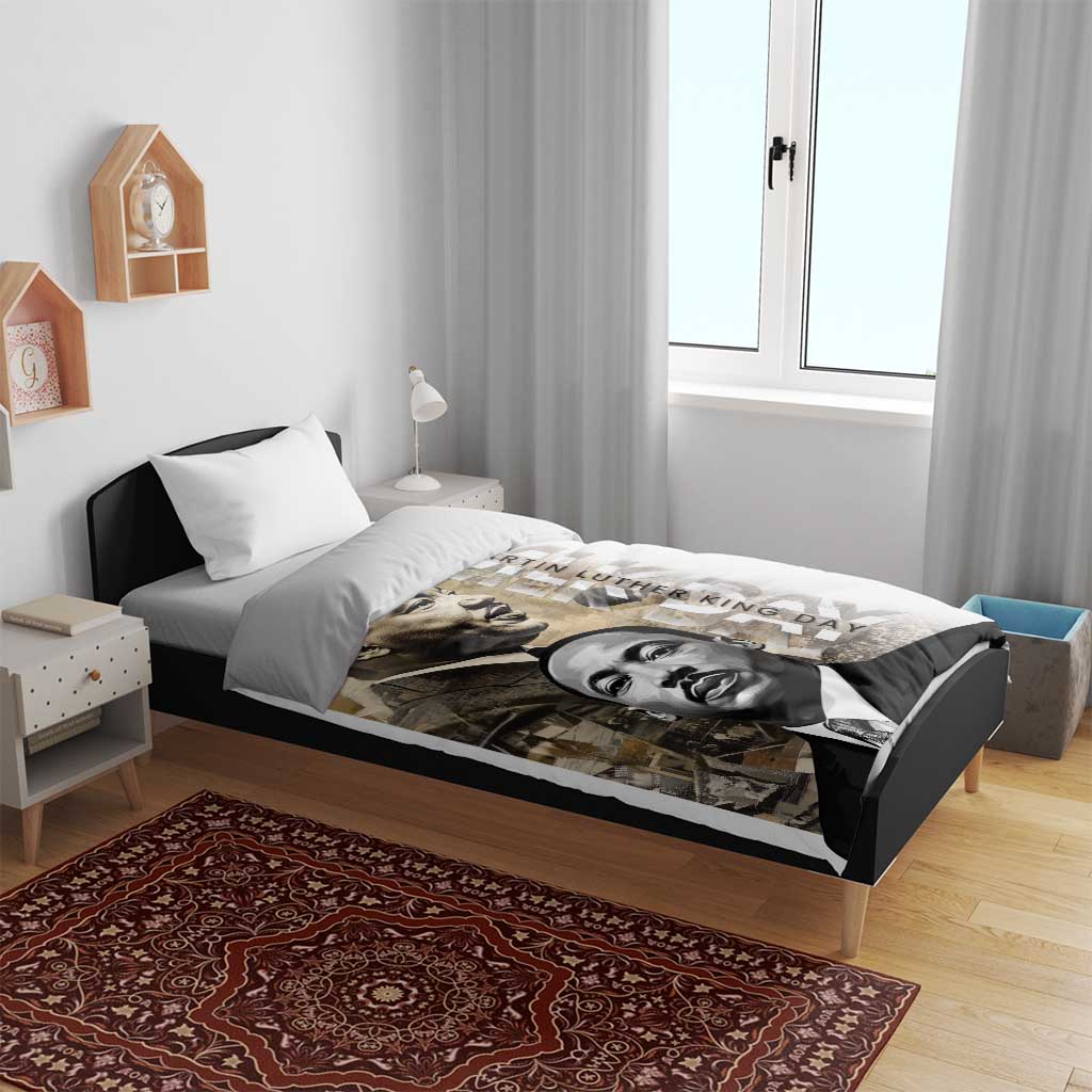 White bedding set with MLK portrait print duvet and two white pillowcases on bed frame