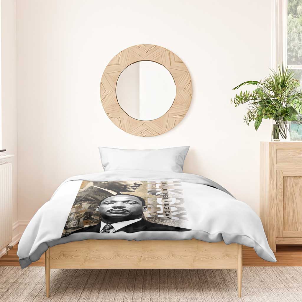 White bedding set with MLK portrait print duvet and two pillowcases on wooden bed