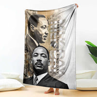 White blanket with large grayscale portraits and vertical “Martin Luther King Day” text