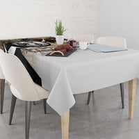 White tablecloth with black-and-white MLK portrait graphic, draped over the table edge