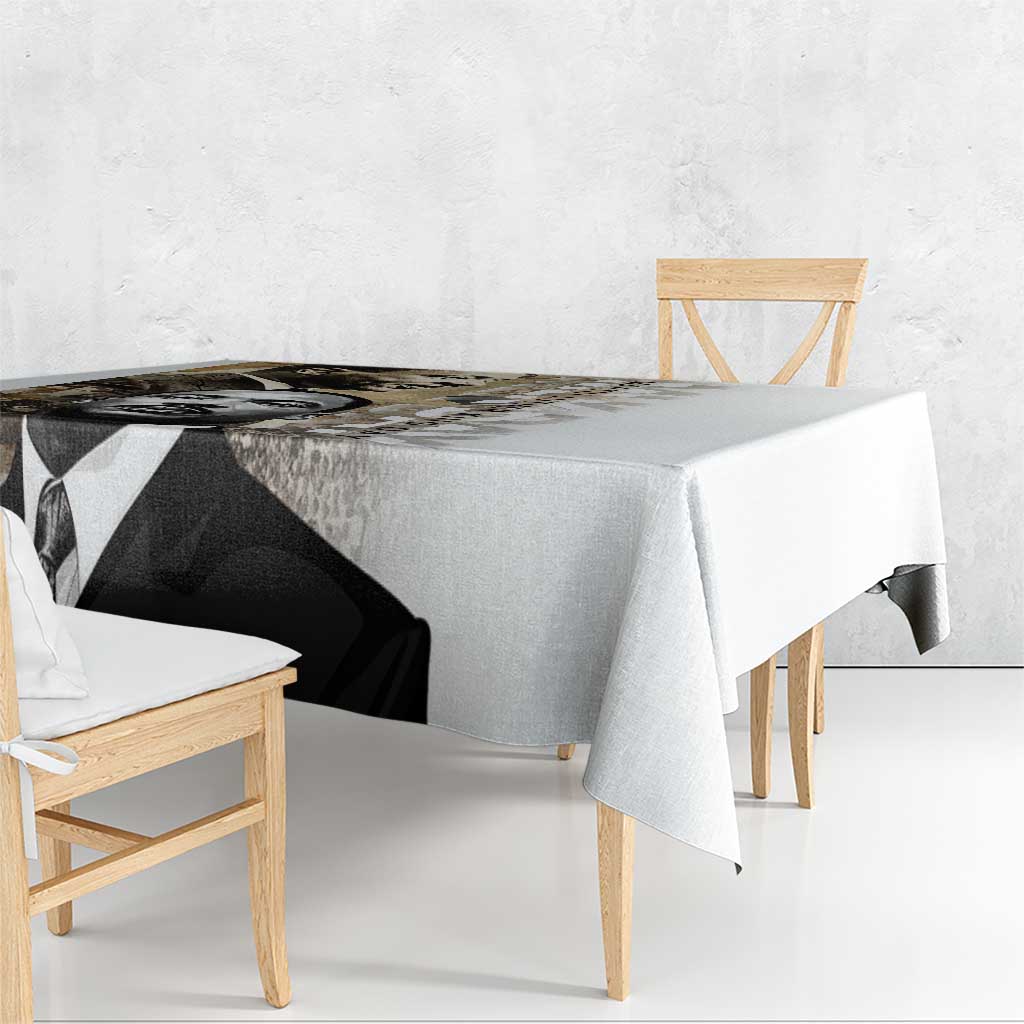 White tablecloth with black-and-white MLK portrait graphic, draped over a dining table