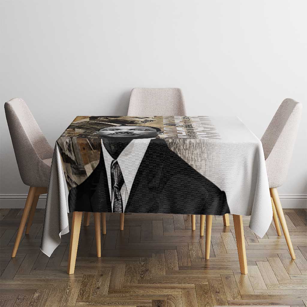 White tablecloth with black-and-white MLK portrait graphic, covers a dining table top