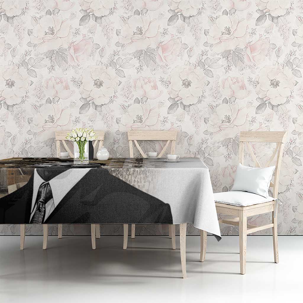 White tablecloth with black-and-white MLK portrait graphic, set across a dining table