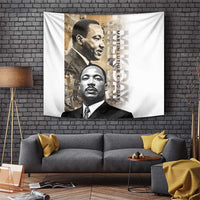 Martin Luther King Jr Day tapestry hanging on a brick wall with two portrait faces and text