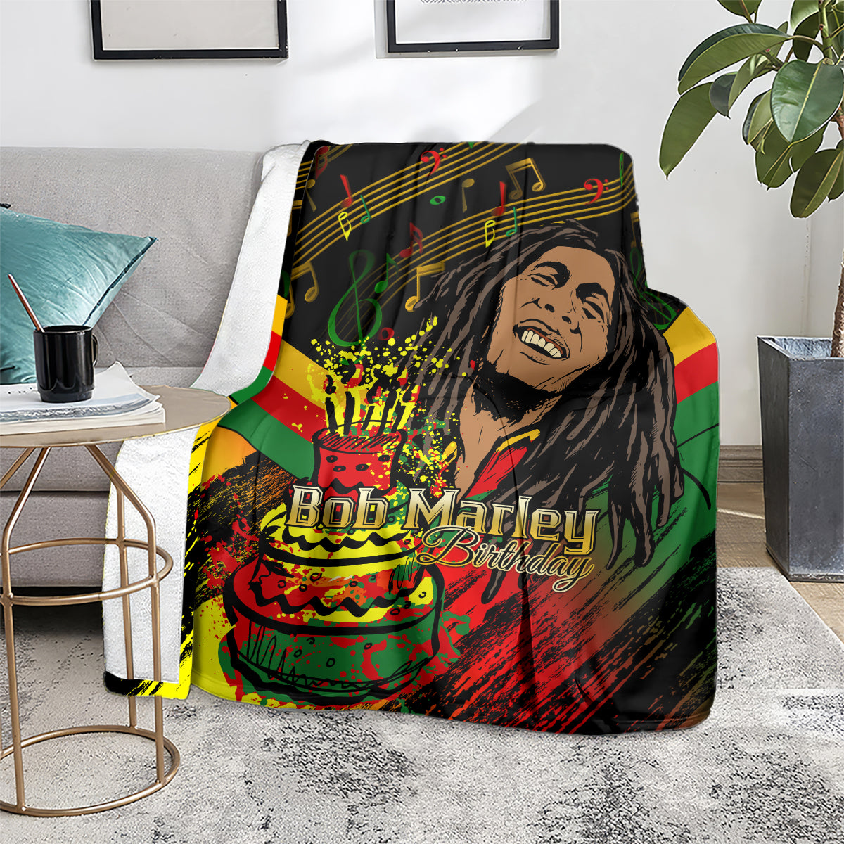 Bob Marley birthday blanket with colorful stripes, music notes, and cake graphic