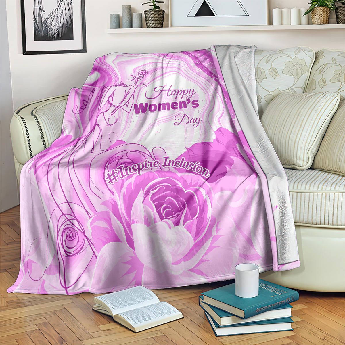 Purple throw blanket with Happy Women’s Day text and #Inspire Inclusion floral design