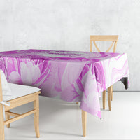 Purple printed tablecloth with tulip-like florals, neatly draped on a dining table