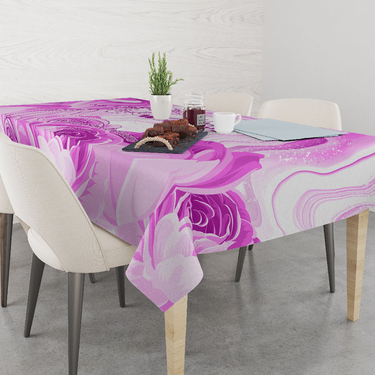 Purple printed tablecloth with floral swirls, laid across a table surface