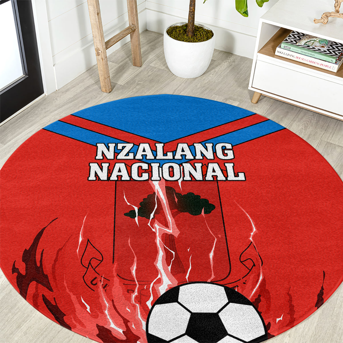 Red round football carpet with blue center stripe, Nzalang Nacional text, and soccer ball