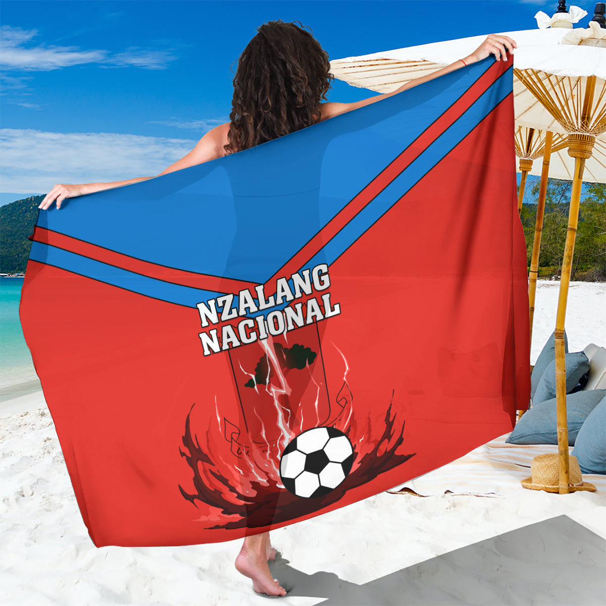 Red football sarong with blue diagonal stripes, Nzalang Nacional text and soccer ball