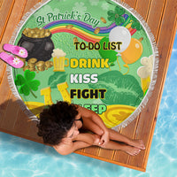 Round green beach blanket with white fringe, St Patrick's Day to-do list and clover artwork