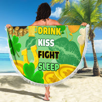 Round green beach blanket with white fringe, shamrock-themed to-do list and rainbow artwork