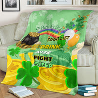 Green St. Patrick's Day blanket draped over sofa with clover and rainbow graphics