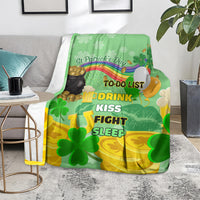 Green St. Patrick's Day blanket covering chair with clovers, rainbow, and TO-DO text