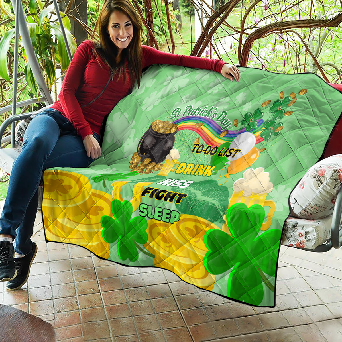 St. Patrick’s Day quilt over patio couch with clovers, cauldron, and rainbow