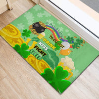 Green rubber doormat with shamrock clover pattern and to-do list text, pot of gold and coins