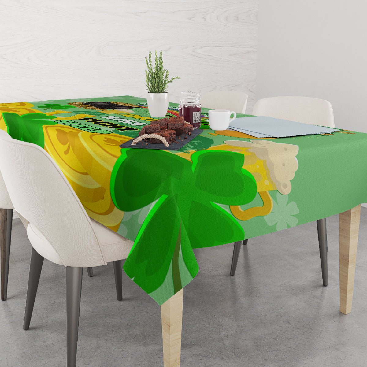 Green and gold shamrock tablecloth over table edge, clover pattern with curved shapes