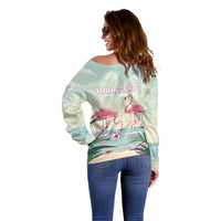Off-shoulder mint sweater back view with 'YOUR TEXT' flamingo print and long sleeves
