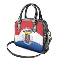 Handbag with black top handles, crossbody strap, and red-white-blue coat-of-arms front
