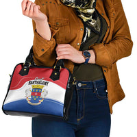 Shoulder handbag with black handles and red-white-blue crest logo on front panel