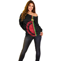 Black off-shoulder sweater with large circular Malawi flag sun graphic and coat of arms