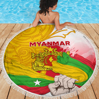 Round beach blanket with fringe edge, Myanmar flag-style graphic shown outdoors