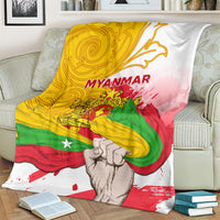 Myanmar flag blanket with MYANMAR text, clenched-fist graphic, swirling accents in yellow green red