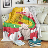 Myanmar flag blanket with MYANMAR lettering and clenched-fist print, splatter details in red and green