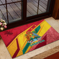 Red rubber doormat with Grenada crest over flag stripes, sparkly glitter texture