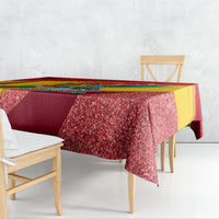 Red glitter-speckled tablecloth with multicolor side panels and patriotic design