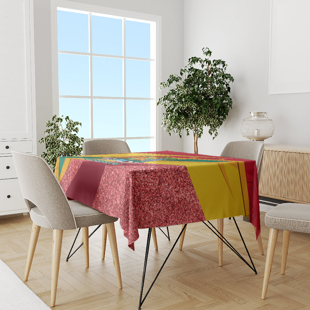 Red glitter tablecloth with yellow and green bands on a dining table with chairs