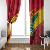 Red Grenada flag window curtain with diagonal bands and glittery red lower edge.