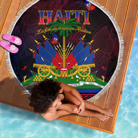 Round fringed beach blanket showing central Haitian-themed HAITI graphic with crossed cannons