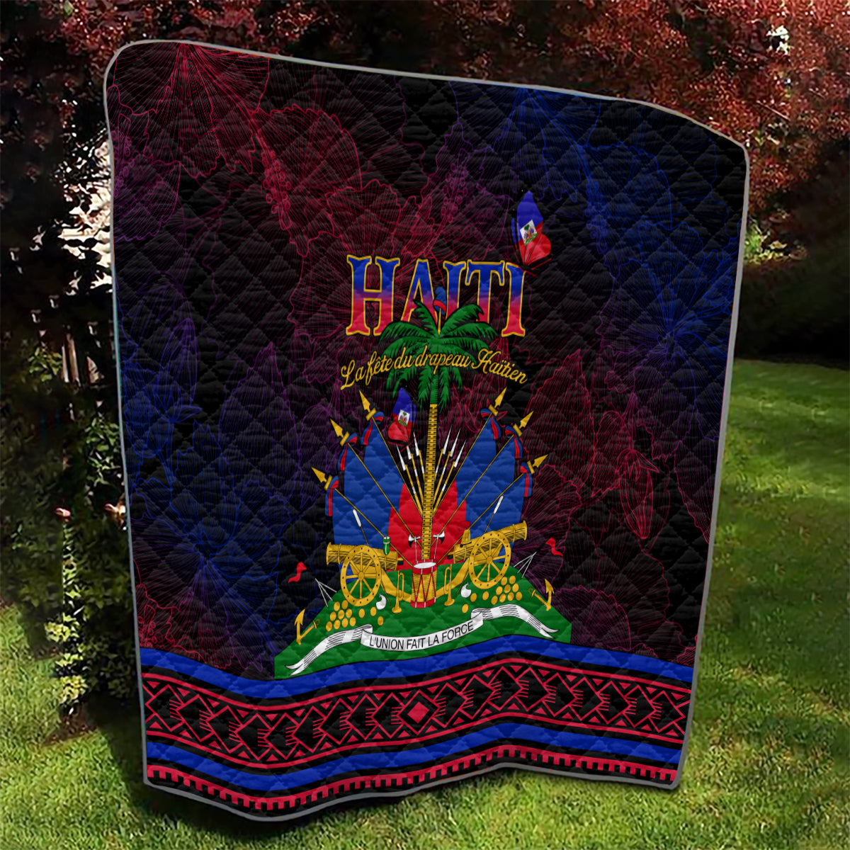 Haitian Flag Day quilt, close view of center Haiti emblem with red/blue border and dark quilted texture.