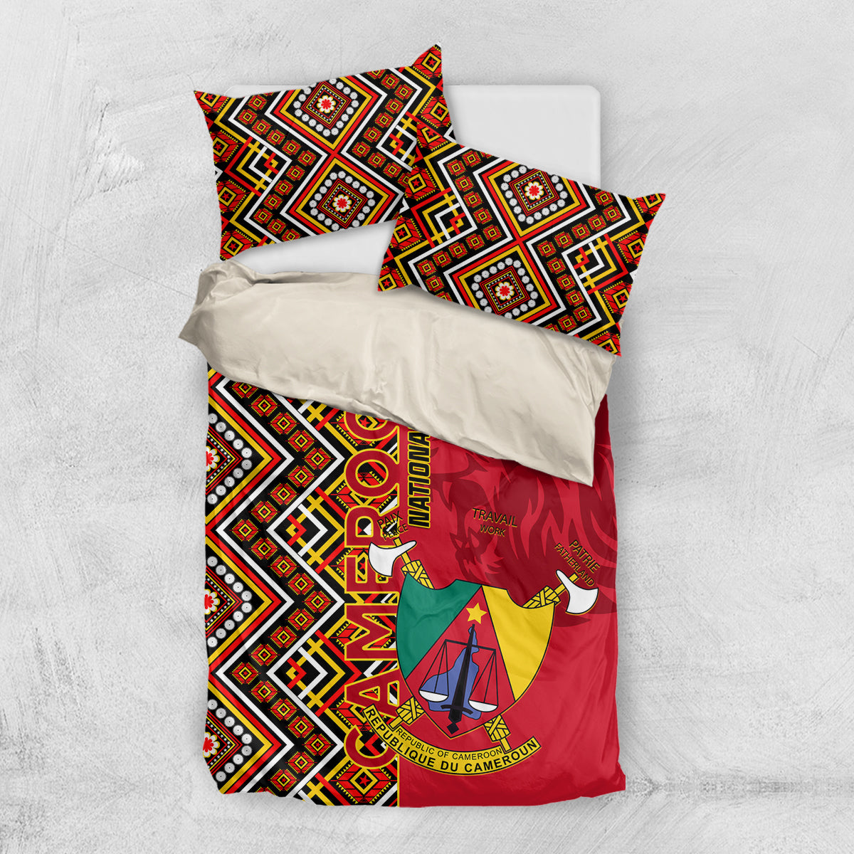Cameroon bedding set laid flat: red duvet with coat of arms and geometric black-and-white side panels